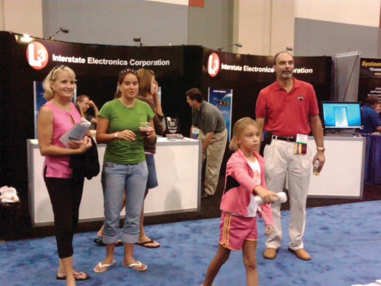A young bowler from Bavaria (above) and ION President Mikel Miller’s family (below) enjoy an evening at the GPS World bowling alley.