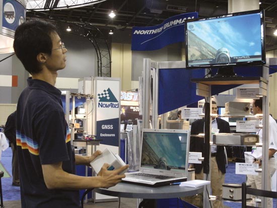 A visitor to NovAtel’s booth tries his piloting hand in a 3-D attitude solution with NovAtel’s GPS/INS SPAN-CPT product. Used as a controller in the flight simulator, it mimics an actual SPAN application as profiled in the September GPS World.