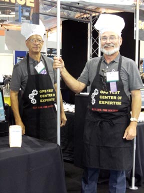 Chefs from U.S. Air Force 746th Test Squadron GPS Test Center of Expertise cook up a winning formula for a booth display, a RECIPE of Resources, Experience, Capability, Innovation, Process, and Efficiency. Visitors were asked to solve an intriguing word puzzle to receive a delicious prize.
