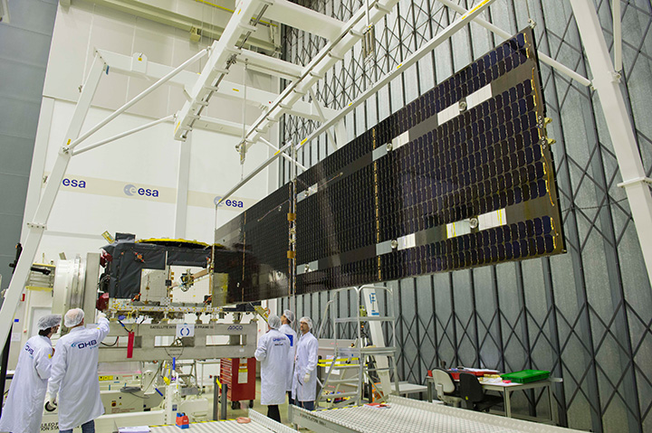 Deployment of the solar wings on the first Galileo satellite 'Full Operational Capability' satellite is shown being checked at ESA’s ESTEC technical hub in the Netherlands at the end of June 2013. The navigation satellite’s pair of 1 x 5 m solar wings, carrying more than 2500 state-of-the-art gallium arsenide solar cells, will power the satellite during its 12-year working life.