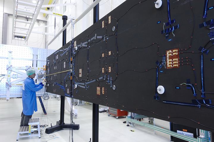 Solar arrays for a Galileo Full Operational Capability (FOC) satellite at the Dutch Space company near Leiden in the Netherlands. A pair of 5 m-long solar arrays supply 1.9 kilowatts of power – about the same as an average household’s consumption. The side of the solar array normally left in shadow is seen here.