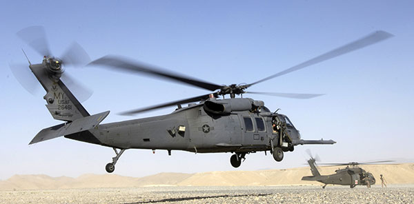 An HH-60 Pave Hawk helicopter lands in Afghanistan; a UH-60 Blackhawk is in the background. (Photo: (U.S. Air Force photo/Senior Airman Brian Ferguson)