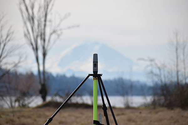 Mount Rainier (above) serves as the backdrop for a field project by Schrock (right). (Photo: Gavin Schrock)
