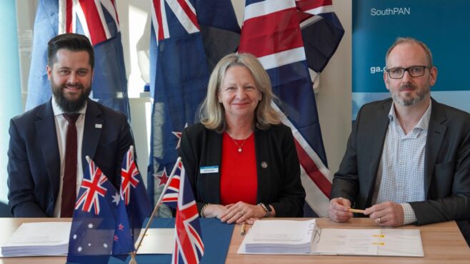 Simon Reynolds (left) engineering manager for SouthPAN; Melissa Harris, CEO of Geoscience Australia (center); and Stuart Bryce, vice president of Capture and Strategy, Viasat, sign the contract in Canberra, Australia.(Photo: Viasat)
