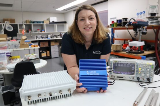 Cohda’s U.S. Sales Director Katherine Mertz with Cohda’s MK6 hardware. (Credit: Cohda Wireless)