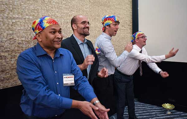 RAINBOW CONNECTION: Taking on giant pong are members of the rainbow bandana team, (from left) Sanjeev Gunawardena, Thomas Pany, Steffen Thoelert and André Hauschild. (Photo: GPS World)