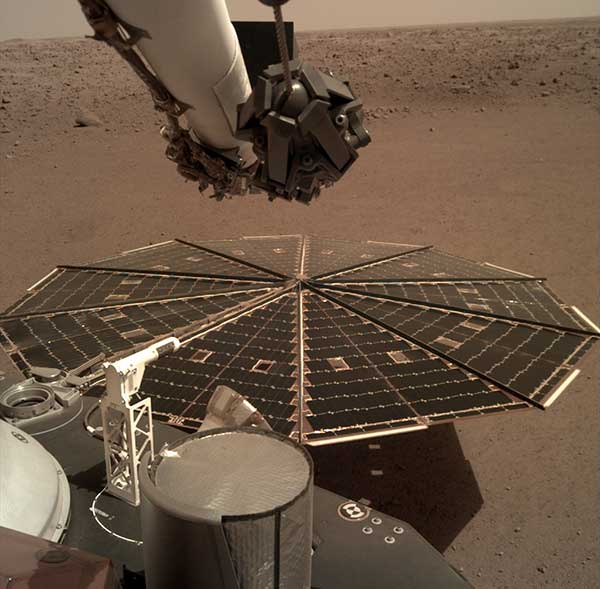 One of the two solar arrays on the InSight lander dominates this view of the plain of Elysium Planum, taken Dec. 4, 2018. (Image: NASA/JPL-Caltech)