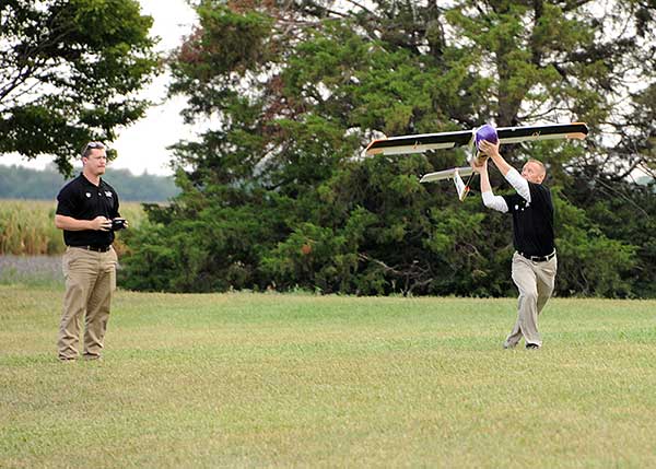 Launching a UAV for a BVLOS flight are (at left) Travis Balthazor, UAS flight operations manager, and Mike Kuni, UAS flight instructor/pilot, both of Kansas State University Polytechnic Campus. (Photo: KDOT, Division of Aviation)